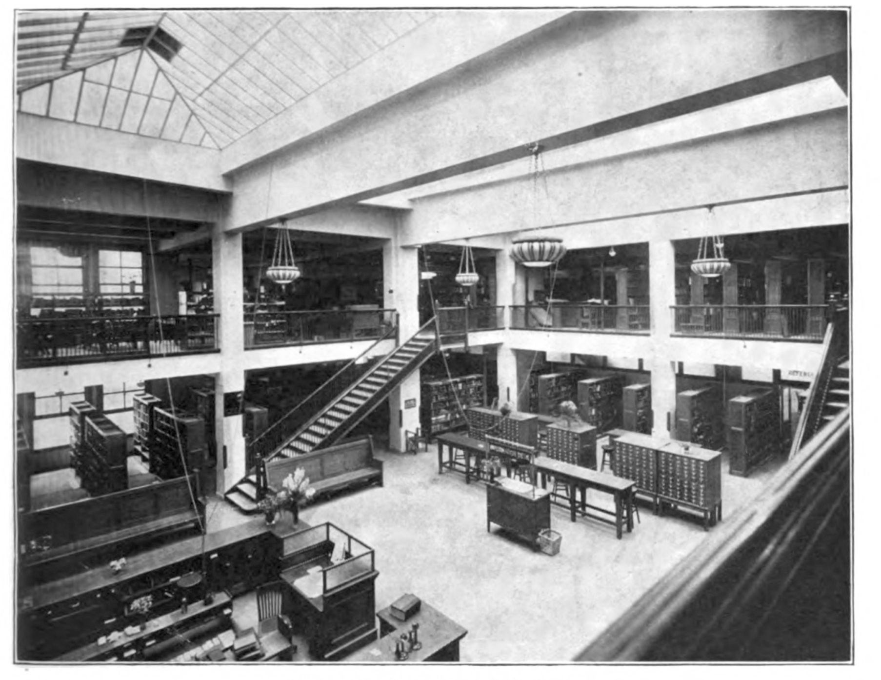 Metropolitan Building shows the Reference Desk in front of the card catalogs