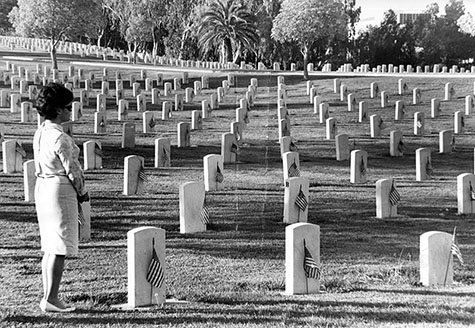 In memory - Alone and in groups, thousands of persons throughout the Southland today visited cemeteries, parks and ships at anchor to pay tribute to the men and women who gave their lives for their country