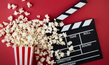 Image of of a spilled popcorn box and a clapperboard.