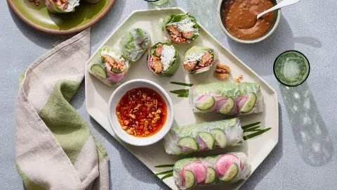 Spring rolls on plate with two dipping sauces